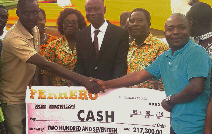 Mr Alex Gyedu of Transmar (right) presenting one of the cheques to Mr Fred Amponsah, the President of the Kookoo Pa Association. With them are Rev Emmanuel Ahia Clottey (2nd right) and Mr Stephen Yeboah (middle), the District Chief Executive for Atwima Mponua